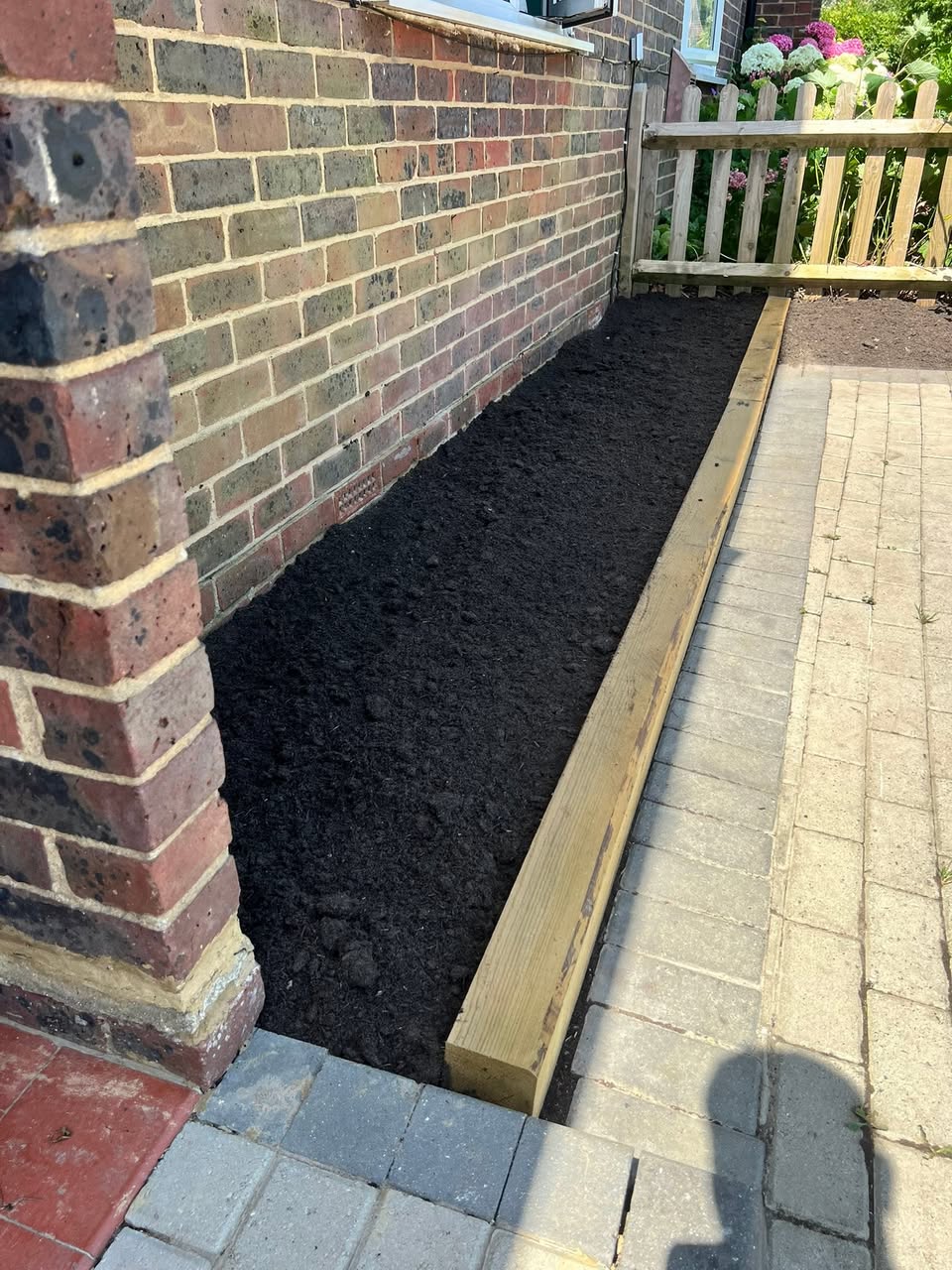 New timber-edged border & topsoil install